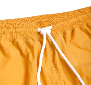 METAL LOGO WRINKLED NYLON SHORT IN YELLOW