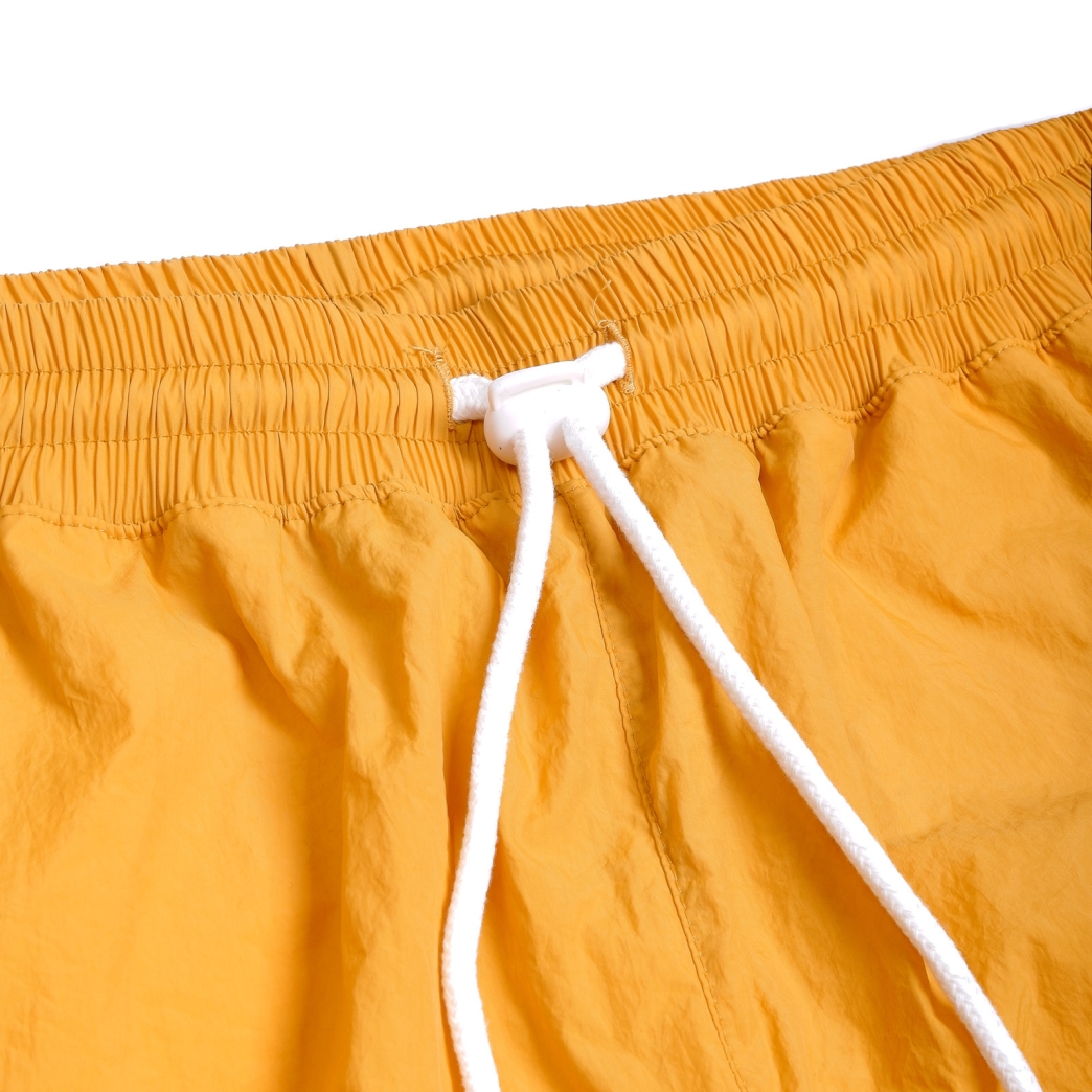 METAL LOGO WRINKLED NYLON SHORT IN YELLOW