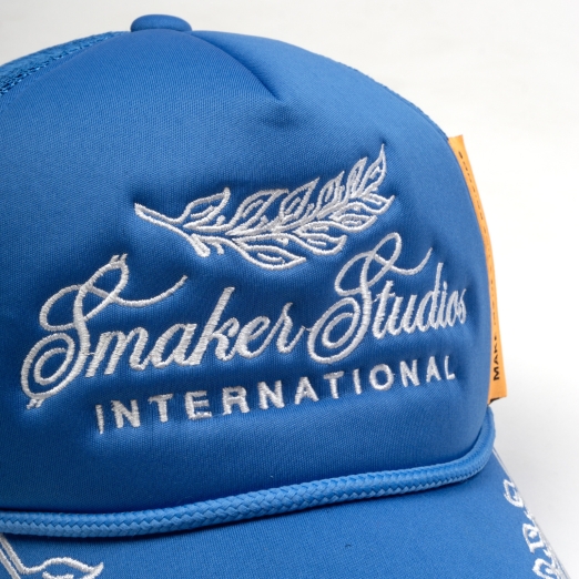 SMAKER STUDIO INTERNATIONAL TRUCK HAT IN BLUE