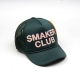 SMAKER CLUB TRUCK HAT IN DARK GREEN